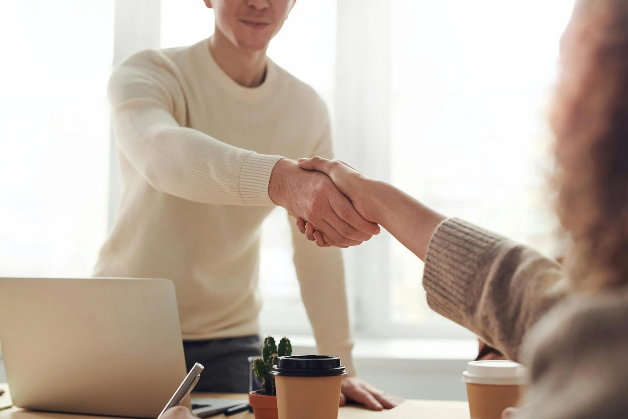 Private practice growth coach shaking hands with a client