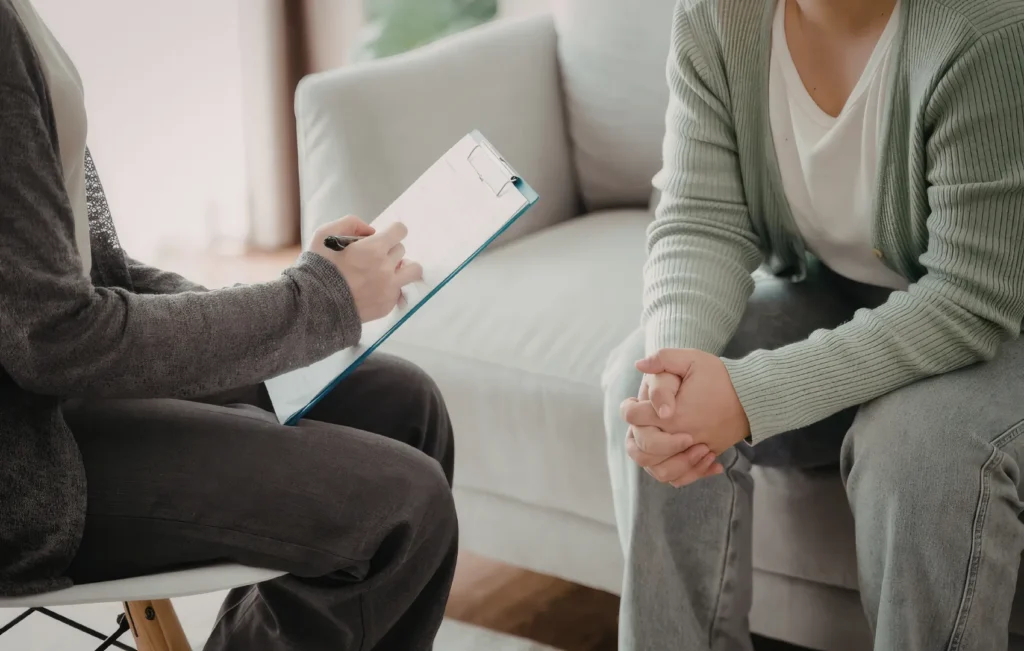 clinician meeting with a client at a mental health group practice