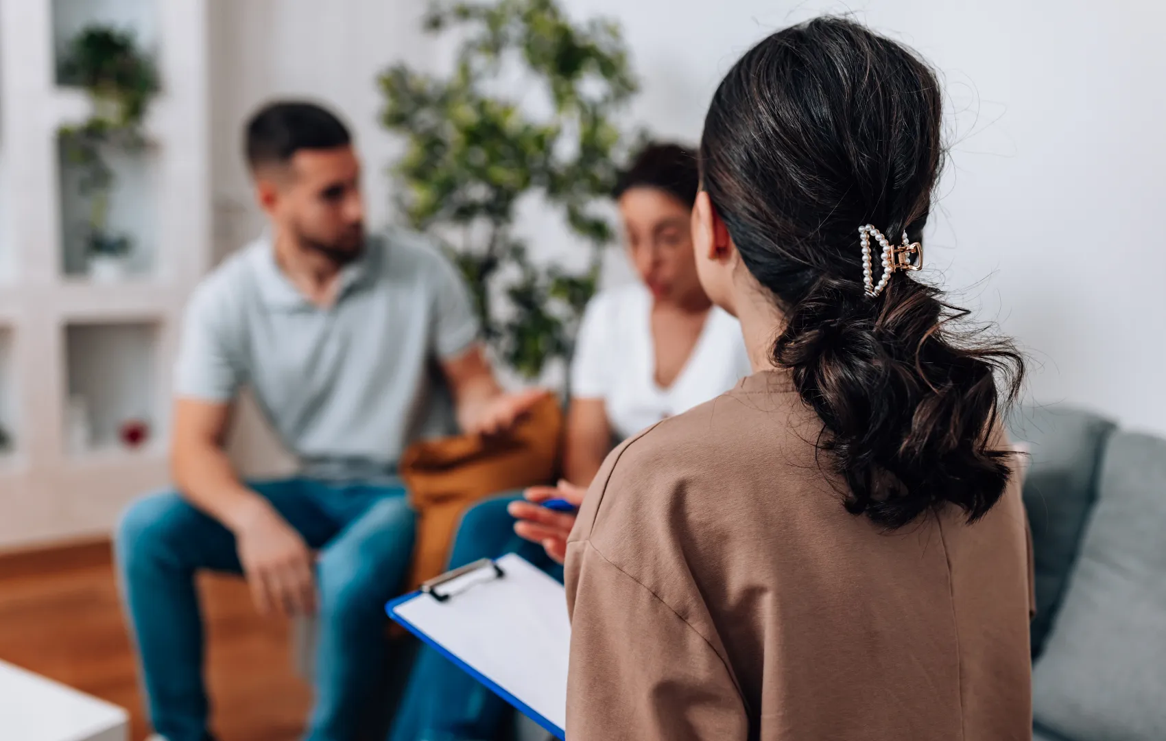 Counselor sitting in room with a couple