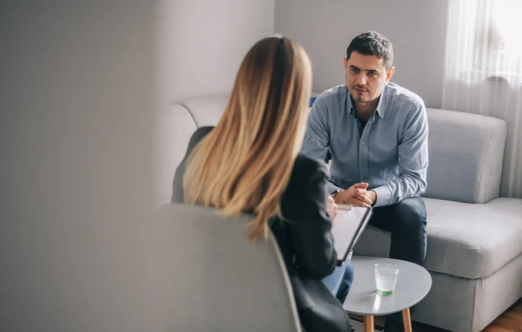 Therapist sitting with a client during a counseling session
